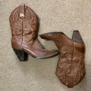 Heeled western style calf high boots.